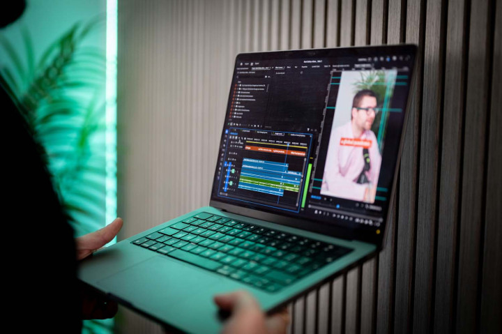Video editing software with portrait footage open on MacBook screen