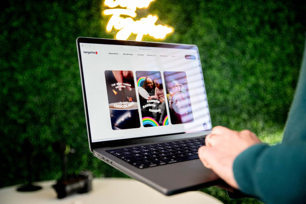 MWB portfolio website with project thumbnails displayed on MacBook